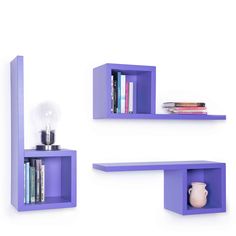 two purple shelves with books on them and a light bulb in the middle one shelf is filled with books