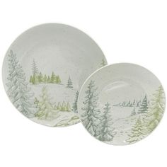 two white and green plates with trees on the side, one is painted to look like snow