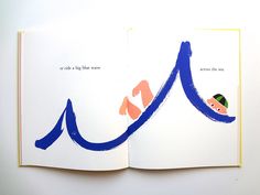 an open book with blue and orange designs on the pages, which has words written in it