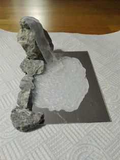 a rock and ice on top of a white towel