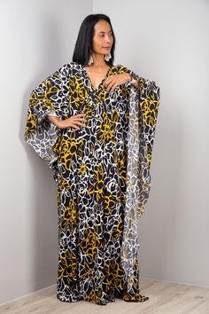 "V neck Kaftan Dress Oversized Women's Frock Maxi Dress Long loose fit dress with floral print  Funky Elegant Collection --> Produced by NUICHAN & Co   PRODUCT SIZE : One Size Fits Most * Chest : free up to 32 - 58\" * Waist : free up to 58\" * Hips : free up to 56\"  * Length : 58\" from shoulder to hem, measured laying flat - when hanging it measures up to 60\" ) * Sleeve length : 24\" MATERIAL  * ITY Polyester MODEL : * Model chest : 32\", waist : 24\" hips : 35\"  * Combined Height is 5\"6 > Flowy Printed V-neck Tunic, Yellow Printed V-neck Kaftan, Black Printed V-neck Kaftan, Printed V-neck Free Size Kaftan, Oversized V-neck Floral Print Dress, Free Size Floral Print V-neck Kaftan, Floral Print V-neck Free Size Kaftan, Flowy Yellow Tunic Kaftan, Oversized Yellow Maxi Dress