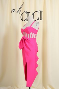 a mannequin with a pink dress on display