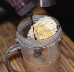 a cup filled with ice cream and chocolate