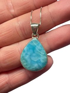 "Hello, details for this piece gemstone (s):Genuine Larimar Total Long (inch): 1 1/4\" Total Weight (gram): 4.2 (including gemstone & silver) Setting Metal: 925 Solid Sterling Silver Style: Pendant with 16 inch chain ( snake) included. I ethically source all my raw crystals and create these works of art! This is genuine Dominican Republic Larimar that is very hard to find at this quality. This is super sea beautiful coloring and top quality. I also have one other piece listed if interested Handm Sterling Silver Cabochon Drop Jewelry, Blue Cabochon Drop Jewelry, Blue Drop Cabochon Jewelry, Blue Drop Jewelry With Cabochon, Raw Crystals, Mermaid Jewelry, Larimar Pendant, Crystal Blue, Silver Style