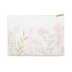 a white pouch with pink and green flowers on the front, along with gold zipper