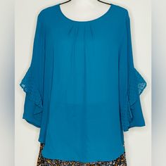 Elevate Your Wardrobe With This Stunning Van Heusen Blouse Top In A Beautiful Blue Hue. The 3/4 Bell Sleeves With Ruffle Accents And Scoop Neckline Make It A Perfect Choice For Any Occasion, Be It Casual, Formal, Or Workwear. The Blouse Has A Regular Fit And Is Made Of Polyester Material With A Rayon Fabric Type. It Also Features A Pullover Closure And Is Machine Washable For Easy Care. The Blouse Comes In A Size Large And Is Unlined, Making It Suitable For All Seasons. With Its Solid Pattern An Clothes For Women Over 50, Scoop Neck Blouses, Van Heusen, Rayon Fabric, Womens Vans, Blue Hues, Solid Pattern, Blouse Top, Beautiful Blue