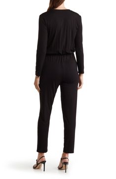 Crafted from stretchy modal, this long-sleeve jumpsuit keeps you looking stylish without sacrificing comfort. Split neck Long sleeves 90% modal, 10% spandex Hand wash, dry flat Imported Versatile Stretch Jumpsuits And Rompers For Work, Black Elastane Jumpsuits And Rompers For Loungewear, Stretch Jumpsuits And Rompers For Fall Loungewear, Black Elastane Jumpsuits And Rompers For Work, Black Elastane Jumpsuits For Workwear, Black Elastane Jumpsuit For Work, Casual Long Sleeve Elastane Bodysuit, Black Long Sleeve Jumpsuits For Loungewear, Chic Long Sleeve Bodysuit For Loungewear