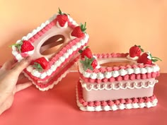 two cakes made to look like they are decorated with strawberries