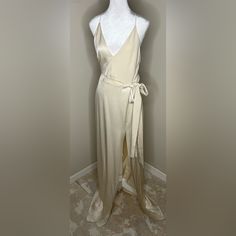 Halston Heritage Cream Dress Sleeveless Cream Maxi Dress For Cocktail, Cream Sleeveless Maxi Dress For Cocktail, Elegant Sleeveless Satin Wrap Dress, Formal Summer Satin Wrap Dress, Summer Formal Satin Wrap Dress, Formal Satin Wrap Dress For Summer, Elegant Sleeveless Silk Wrap Dress, Spring Formal Floor-length Wrap Dress, Silk A-line Maxi Dress For Date Night