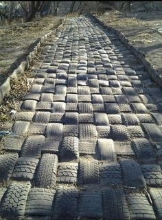 an old brick road made out of tires