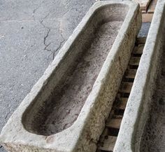 two concrete sinks sitting on top of each other