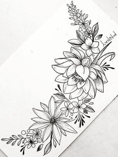 a black and white drawing of flowers on paper