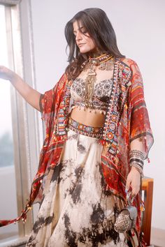 Multi colored dupatta style jacket with collage print in sheer silk base with embroidered and tribal tassel detail on neck and hem.
Component: 1
Pattern: Printed, Embroidered
Type Of Work: Floral and Geometric Motifs
Neckline: Front Open
Fabric: Sheer Silk
Color: Multi Color
Other Details: 
Tassel details
Note: The corset, tunic, skirt and jewellery, bag shown in the image is not for sale
Occasion: Puja
Disclaimer: Variations in colour and the positioning of artwork may be different from that as Dupatta Style, Jewellery Bag, Geometric Motifs, Jacket For Women, Print Collage, Fashion App, Print Jacket, Jackets Online, Aza Fashion