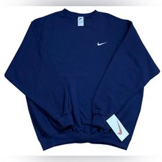 New With Tags, Sealed In Original Plastic -Length 31 Inches; Pit To Pit 27 Inches; Sleeve 24 Inches (Xl) Vintage Nike Swoosh Navy / White Crewneck Sweatshirt. If You Miss The Quality Of The 90s, Here Is Your Chance To Get This Never Tried Or Worn Before Navy Crewneck. The Swoosh Is Embroidered In White On The Heavy Duty Sweatshirt. Nike Sportswear Crew Top, Nike Sporty Crew Top, Nike Crew Neck Athleisure Top, Nike Navy Sporty Sweatshirt, Navy Crew Neck Sweatshirt In Athleisure Style, Nike Blue Crew Tops, Nike Blue Tops For Fall, Nike Navy Tops For Streetwear, Nike Cotton Sports Sweater