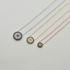 Sterling Silver Evil Eye Necklace, Designed with round charm, Evil eye necklace adorned with sapphire blue CZ stones and crystal clear CZ stones, Pendant size (diameter) ; Small 0.3inch (7.4mm) Medium 0.4inch(10mm) Large 0.55inch(14mm) 925 Sterling Silver with Real Sapphire and CZ stones(Evil Eye Jewelry) if you need longer chain can be upon request, please send me a convo, All my jewelry is handcrafted with pure and 925 sterling silver, This is a safe way for you to store bracelet will be sent Cz Stone Necklace, Necklace Evil Eye, Evil Eye Protection, Stones Necklace, Amulet Necklace, Evil Eye Necklace, Evil Eye Jewelry, Eye Jewelry, Eye Protection