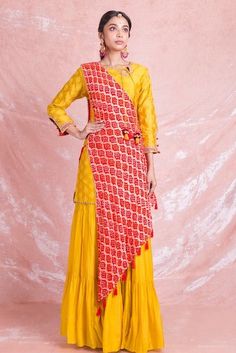 Shop stunning yellow designer sharara suit online in USA with red draped Bandhej dupatta. Champion ethnic fashion on weddings and festivals with a stunning collection of designer Indian dresses, Indowestern outfits, salwar suits, Anarkali suits from Pure Elegance Indian fashion store in USA.-full view Yellow Anarkali Palazzo Set With Straight Kurta, Yellow Slub Silk Salwar Kameez With Dori Work, Unstitched Yellow Slub Silk Sharara, Yellow Slub Silk Traditional Wear With Gota Work, Yellow Slub Silk Bollywood Set, Yellow Palazzo Set With Gota Work And Straight Kurta, Traditional Yellow Palazzo Set With Gota Work, Yellow Palazzo Set With Straight Kurta And Gota Work, Traditional Yellow Slub Silk Anarkali Set