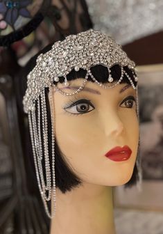 "Gorgeous Great Gatsby Pearl and Chain  headpiece.  Done with a solid Crystal Applique with Crystal and, Pearl Droplets going across the forehand  and, crystal sides in the form of loops. All attached to a stretch to fit band in Black. This is \"LIBERTY\"    Ladies are returning to a time of Elegance and, Glamour! The Old Hollywood Style Always Glamorous in the past and, now more then ever. . Gorgeous piece! Very Art Deco! Very Gatsby! THIS ONE IS A SHOWSTOPPER! HIGH-END STATUS! Stunning for a W 1950’s Dress, Flapper Inspired Dress, Great Gatsby Headpiece, Gatsby Gala, Chain Headband, Chain Headpiece, Rhinestone Headpiece, Flapper Headband, Silver Head Piece