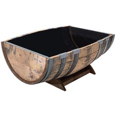 an old wooden barrel with black top