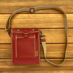 "Small red leather shoulder bag, made entirely by hand. It's a small messenger-type bag. It measures only 9.4 x 7.9 x 2\", but it fits all the essentials (wallet, smartphone, glasses, keys...). It has two pockets, one inside for the cellular phone and the other external closed with a push button. It is made with top quality bovine leather and hand sewn with waxed thread with the unmistakable Pielroja style. The result is a handy bag, original and stylish, a shoulder bag ideal for women optimistic and daring, but if you do not like the red color, you have it available in other colors. And if you find it small, there is another bigger model, there are bags for all tastes! https://www.etsy.com/es/shop/Pielroja?section_id=23139989 SHIPPING AND RETURNS The order will be ready in 5-10 days. The Red Leather Phone Shoulder Bag, Handmade Red Crossbody Shoulder Bag, Neck Wallet, Red Leather Shoulder Bag With Turn-lock Closure, Compact Red Leather Wallet, Daily Red Bag With Silver-tone Hardware, Cellular Phone, Safe Travel, Messenger Bags