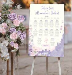 a wedding seating sign with flowers and greenery on it next to an easel