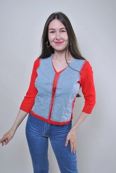 Add a pop of color to your summer wardrobe with this vintage 90s red blouse. Featuring quarter sleeves and a fun, unique design, this blouse is perfect for adding a playful touch to your outfit. Size: S Measurements (approximate): Sleeve: 32cm / 12.59 inches (from armpit to end of sleeve) Width: 36cm / 14.17 inches Length: 53cm / 20.86 inches All measurements are taken seam to seam while lying flat. Please note that as this item is vintage, it may have some defects, adding to its character. Addi Retro V-neck Summer Shirt, Y2k Long Sleeve Summer Shirt, Y2k Style Long Sleeve Summer Shirt, Fun Long Sleeve Summer Tops, Casual Red Festival Shirt, Red Half Sleeve Summer Blouse, Fun Red Tops For Fall, Trendy Red Shirt For Spring, 90s Inspired Short Sleeve Shirt For Spring