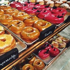 there are many different types of donuts on display