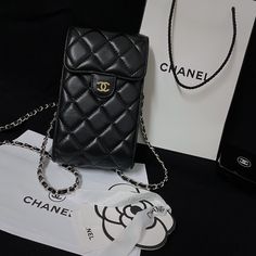 Exquisite Genuine Leather: The Chanel Crossbody Phone Bag is crafted from luxurious genuine leather, offering a refined texture and lasting durability. This high-quality material elevates the bags elegance while ensuring it withstands everyday use. Timeless Chanel Aesthetic: Embodying Chanel's classic design philosophy, this tote bag features the iconic quilting pattern and subtle yet distinctive logo. The timeless aesthetic makes it a versatile accessory, perfect for both casual and formal s... Chanel Plaid, Crossbody Phone Purse, Chanel Crossbody, Phone Purse, Phone Pouch, Quilted Bag, Shoulder Purse, Vintage Handbags, Black Tote Bag