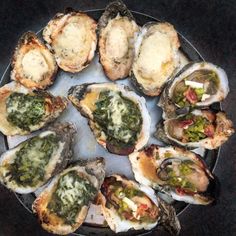 an assortment of oysters on a platter