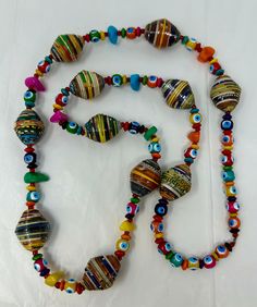 great hand made necklace with paper and wood beads pre-owned, good condition - see photos 36" around Handmade Multicolor Artisan Long Necklace, Multicolor Wooden Beads Long Necklace Gift, Artisan Handmade Multicolor Long Necklace, Multicolor Wooden Beads Long Necklace, Artisan Multicolor Handmade Long Necklace, Multicolor Long Necklace With Wooden Beads, Handmade Vintage Multicolor Long Necklace, Artisan Multicolor Beaded Long Necklace, Vintage Multicolor Handmade Long Necklace