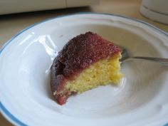 a piece of cake sitting on top of a white plate with a fork in it