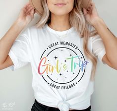 a woman wearing a t - shirt that reads great memories, girl is trip great friends