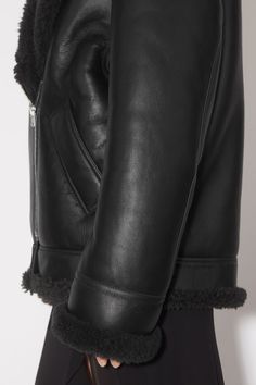 Leather shearling jacket Leather Shearling Jacket, Black Shearling Jacket, Leather Heeled Boots, Shearling Jacket, Neck Strap, Chain Earrings, Strap Dress, Sunglass Frames, Biker Jacket