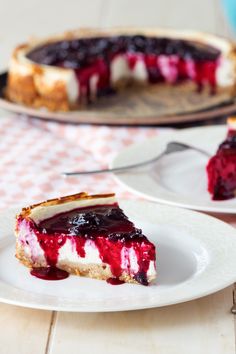 a slice of cheesecake with blueberry sauce on it