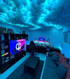 a living room filled with furniture and a flat screen tv mounted to the ceiling under a cloudy blue sky