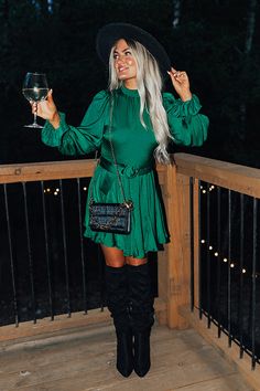 Green Christmas Party Dress, Green Dress For Christmas, Long Sleeve Dress With Boots, Emerald Green Dress Outfit, Christmas Cocktail Dress, Dress With Cowgirl Boots, Green Dress Outfit, Dresses With Cowboy Boots, Long Green Dress