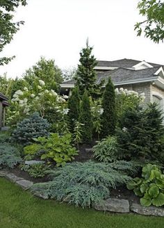 a house with lots of trees and bushes around it