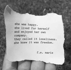 a person holding up a piece of paper with the words she was happy, she lived for herself and enjoyed her own company