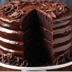 a chocolate cake with one slice missing from it