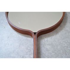 a mirror that is sitting on the floor next to a carpeted flooring area