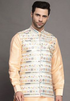 Art Silk Nehru Jacket in Light BeigeThis Readymade Sleeveless attire is Enhanced with Buttons, Mirror Effect and Resham Work. Crafted in Chinese Collar NeckDo note: Brooch and Kurta shown in the image is for presentation purposes only. Half to one inch may vary in measurement. (Slight variation in actual color vs. image is possible) Mens Kurta | Mens Kurta Pajama | Mens Sherwani | Mens Sherwani Sets | Traditional Menswear | Partywear Menswear | Indian Mens Dresses | Diwali Kurta | Kurta Pajama | Traditional Sleeveless Bandhgala With Chikankari Embroidery, Spring Wedding Nehru Jacket In Chanderi, Designer Multicolor Nehru Jacket With Chikankari Embroidery, Bollywood Style Floral Embroidered Chanderi Nehru Jacket, Sleeveless Nehru Jacket With Zari Work For Transitional Season, Festive Multicolor Nehru Jacket With Chikankari Embroidery, Spring Chanderi Nehru Jacket With Resham Embroidery, Spring Resham Embroidery Chanderi Nehru Jacket, Bollywood Style Nehru Jacket With Floral Embroidery For Diwali