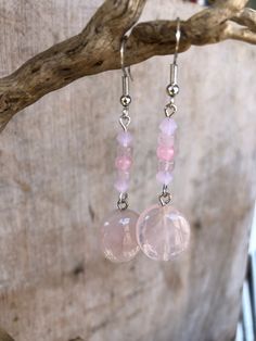 Get inspired with our stunning Rose Quartz and Quartz Crystal drop earrings! These exquisite pieces are the epitome of elegance and sophistication, designed to elevate your ensemble whether you're attending a fancy dress soiree or enjoying a casual dinner with friends. Crafted with care, the Rose Quartz beads represent geometric shapes, adding a contemporary flair to their design, and lending them to versatility.  These beauties will transition effortlessly  from formal affairs to laid-back gatherings with grace and style. Elevate your jewelry collection with these charming accessories, and consider completing your look with our coordinating necklace and bracelet, sold separately. Rose Quartz is often referred to as the "love stone" and is believed to have powerful healing energies that pr Pink Drop Earrings For Birthday, Pink Heart Gemstone Earrings, Pink Heart-shaped Gemstone Earrings, Pink Jewelry With Matching Earrings For Birthday, Round Valentine's Day Earrings With Ear Wire, Valentine's Day Round Earrings With Ear Wire, Pink Round Earrings For Valentine's Day, Pink Round Earrings For Birthday, Elegant Pink Earrings For Birthday