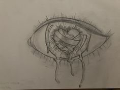 a drawing of an eye with a heart wrapped around it