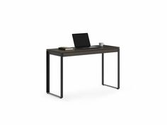 a black desk with a laptop on it