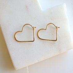 "Heart shaped hoops, lightweight and minimalist. Choose from three sizes and from sterling silver, 14k gold fill or rose gold fill. Super lightweight, you won't even know they are there. Small .75\" Medium 1.25\" Large 1.75\" Metal: Choose from sterling silver, 14k gold fill, rose gold fill Earring Replacements If you were to lose an earring, I will be happy to make a matching one for half price and free shipping! All orders come packaged ready for gift giving. In order to keep down on waste, or Minimalist Hoop Earrings With Heart Charm, Minimalist Huggie Heart Earrings Gift, Hypoallergenic Hoop Earrings For Valentine's Day, Minimalist Hypoallergenic Heart Earrings For Valentine's Day, Hypoallergenic Minimalist Heart Earrings For Valentine's Day, Minimalist Small Hoop Heart Earrings, Minimalist Nickel-free Hoop Earrings For Valentine's Day, Minimalist Heart Jewelry With Ear Wire, Minimalist Hoop Earrings For Valentine's Day