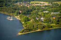 an aerial view of a small island surrounded by trees