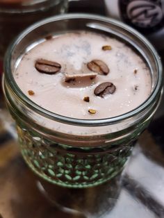 a jar filled with liquid sitting on top of a table