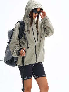 Crafted for hiking and mountain exploration, the Blade Tech® Rain Jacket in matcha green combines functionality with advanced Teflon® coated nylon fabric for superior water, oil, and stain resistance. The multi-directional adjustable hood and hem ensure a perfect fit. Concealed YKK zip pockets, including a chest pocket for quick access and larger storage capacity. Logo prints on the front and back, finished with signature GRKC garment labels. Teflon® Coated Fabric Water, Oil, and Stain-Resistant Multi-Directional Adjustable Hood Concealed YKK Zip Pockets Slightly Oversized Fit Part of the GRKC® Utility Performance Series. Model Eric is 177cm / 5'10" tall and wearing size L Model Kori is 168cm / 5'6" tall and wearing size L *Please allow up to 2 weeks for processing and shipment. Hooded Nylon Raincoat For Hiking, Hooded Nylon Raincoat For Outdoor Activities, Nylon Outerwear With Detachable Hood For Outdoor Activities, Khaki Techwear Windbreaker For Outdoor Work, Sporty Nylon Outerwear For Outdoor Activities, Weatherproof Nylon Windbreaker For Hiking, Green Windproof Techwear Hooded Jacket, Hooded Weatherproof Windbreaker For Hiking, Weatherproof Hooded Windbreaker For Hiking