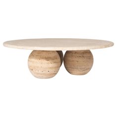 two wooden balls sitting on top of a table