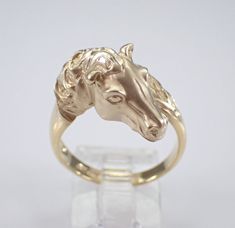 Vintage 14K Yellow Gold Horse Ring. This ring is 14KT Yellow Gold, weighs 5.3 grams and is a finger size 7 1/4, which can be resized (please inquire about sizing with the finger size you need).  I will ship this ring promptly in a gift box. Classic Gold Jewelry With Horse Design, Classic Formal Jewelry With Horse Design, Elegant Yellow Gold Jewelry With Horse Design, Formal Sterling Silver Jewelry With Horse Design, Elegant Round Jewelry With Horse Design, 14k Yellow Gold Jewelry With Horse Design, Timeless 14k Gold Collectible Rings, Horse Ring, Equestrian Jewelry