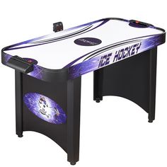 an air hockey table is shown with remote controls